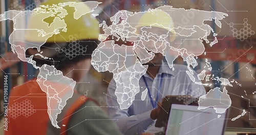 Coordinator tapping tablet and lead viewing laptop causing animated map showing logistics routes