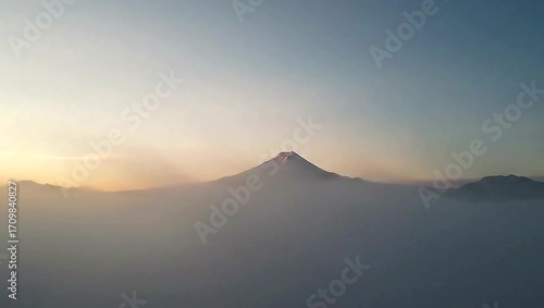 Wallpaper Mural Awe-inspiring and epic drone footage capturing the first light of day hitting a dramatic mountain range, evoking feelings of adventure, achievement, and wonder 4k video  Torontodigital.ca