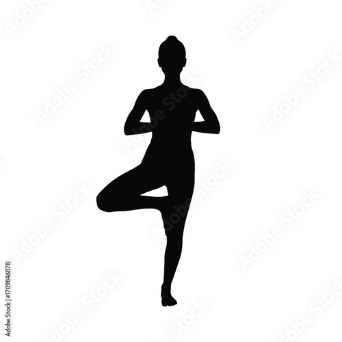 Silhouette of a woman performing the vrksasana tree pose yoga exercise with grace and balance silhouette