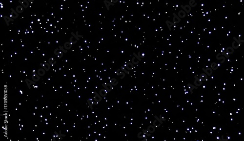 A dense field of small, light-colored dots scattered across a black background