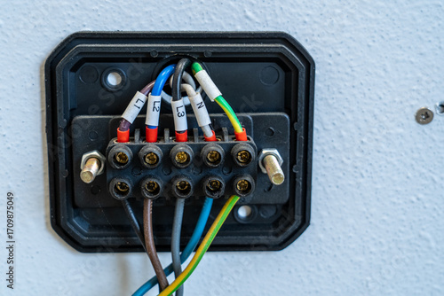 Electrical terminal block with labeled wires on control panel
