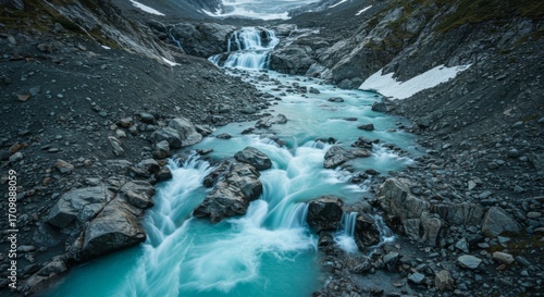 Turquoise Glacial River Flowing Through Rocky Mountain Valley
