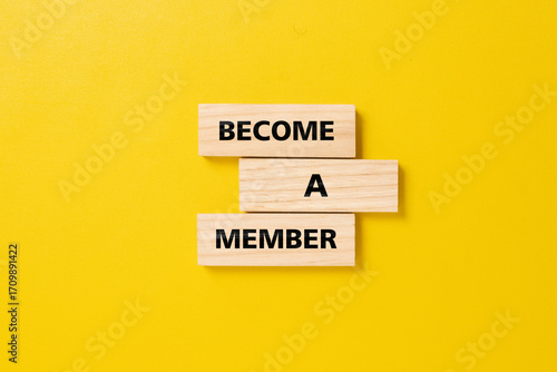 The announcement message become a member on wooden blocks. membership and subscription