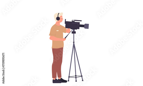 A young man operates a professional video camera on a tripod.