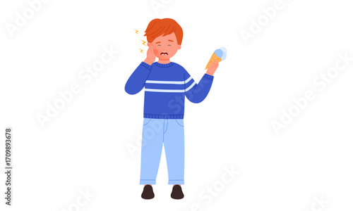 A cartoon boy with red hair experiences a sudden toothache from tooth sensitivity while eating a cold ice cream cone.