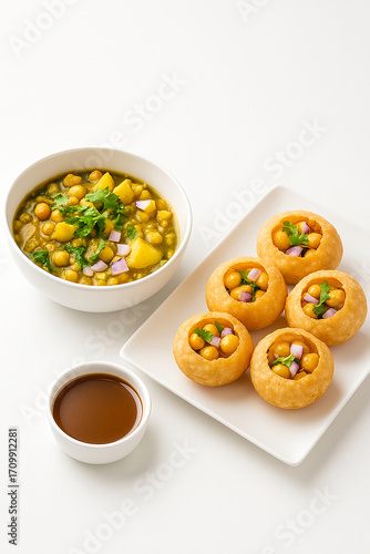 Modern Presentation of Indian Street Food Pani Puri with Chana Filling 
