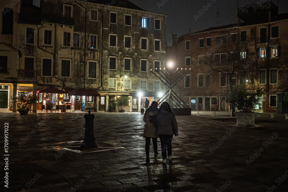Obraz premium Menorah lights up Campo del Ghetto Nuovo during Hanukkah celebration