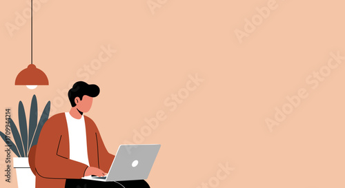 Young man working remotely on his laptop in a modern minimalist home office. Represents productivity, flexible work, and digital lifestyle.