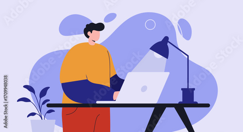 Focused man works efficiently on laptop at his desk. Ideal for business, remote work, online learning, and productivity concepts.