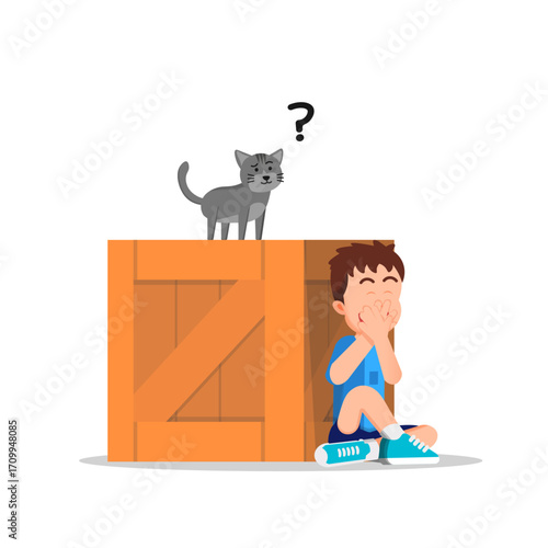 A boy hiding behind a wooden box while his cat searches curiously