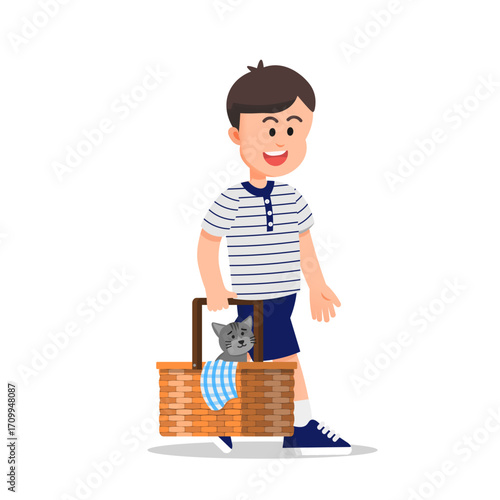 Cute boy walking with a picnic basket carrying his pet cat