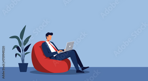A businessman works comfortably on his laptop while sitting on a bean bag chair in a modern, minimalist home office setting, embodying flexible work arrangements.