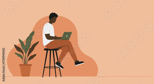 Young Black man focused on laptop, working remotely from a modern, minimalist home office. Ideal for concepts of digital lifestyle, online learning, and flexible work.