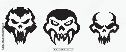 Three menacing black tribal skulls displayed in a stylistic arrangement