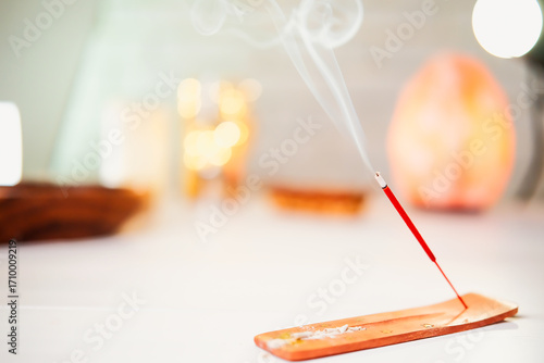Burning scented stick burning on table