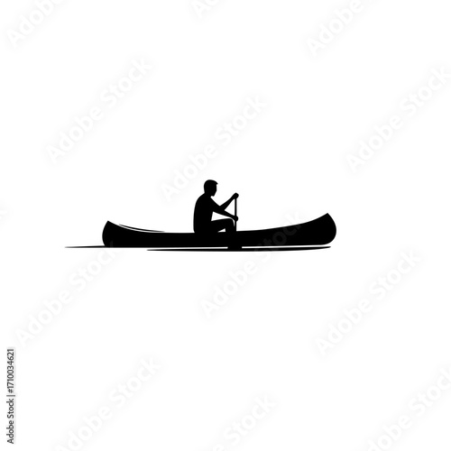 Silhouette of a lone person paddling a canoe across calm water on a bright day