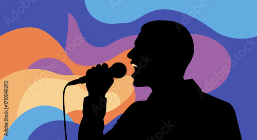 Silhouette of a person singing into a microphone against a colorful background.