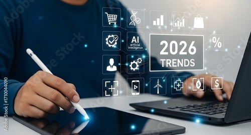 Man analyzing 2026 trends using digital devices.