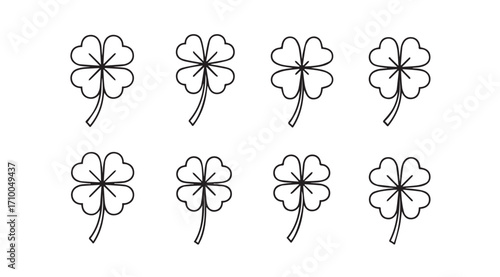 Eight hand drawn four leaf clover silhouettes on a white background