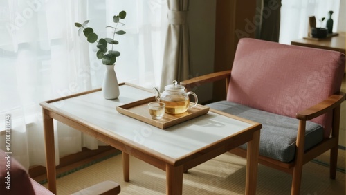 Wallpaper Mural Cozy living room with wooden table, pink armchair, and tea set on tray near window Torontodigital.ca
