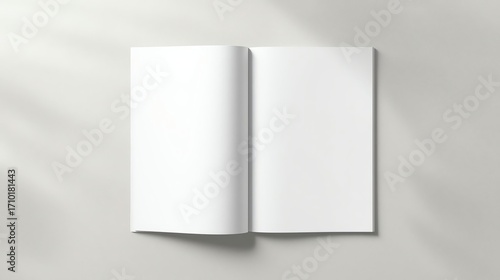Blank open magazine on table ready for mockup, design, or editorial presentation with soft shadows and minimalist background for creative projects.