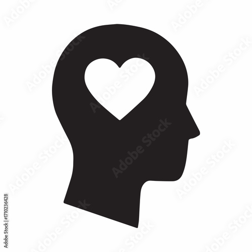 Silhouette head profile with heart symbol inside brain area representing love and emotion