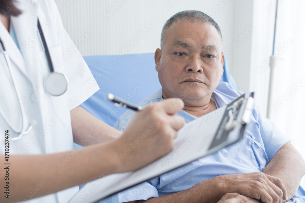 Fototapeta premium The doctor is asking about the symptoms and history of the elderly patient.