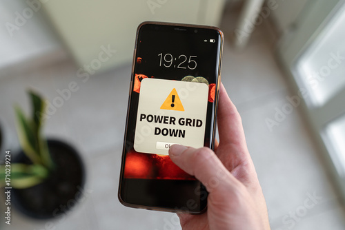Power grid down notification on smartphone screen. Concept of service problems.