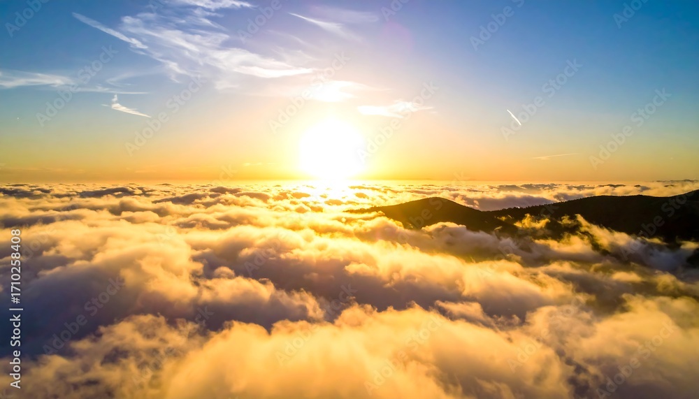 Fototapeta premium Golden sunset above a sea of clouds