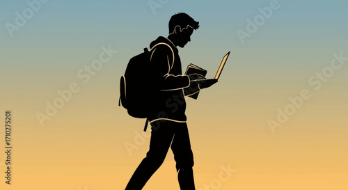 Silhouette of a male student walking with a backpack while holding an open laptop and a book against a gradient sky.