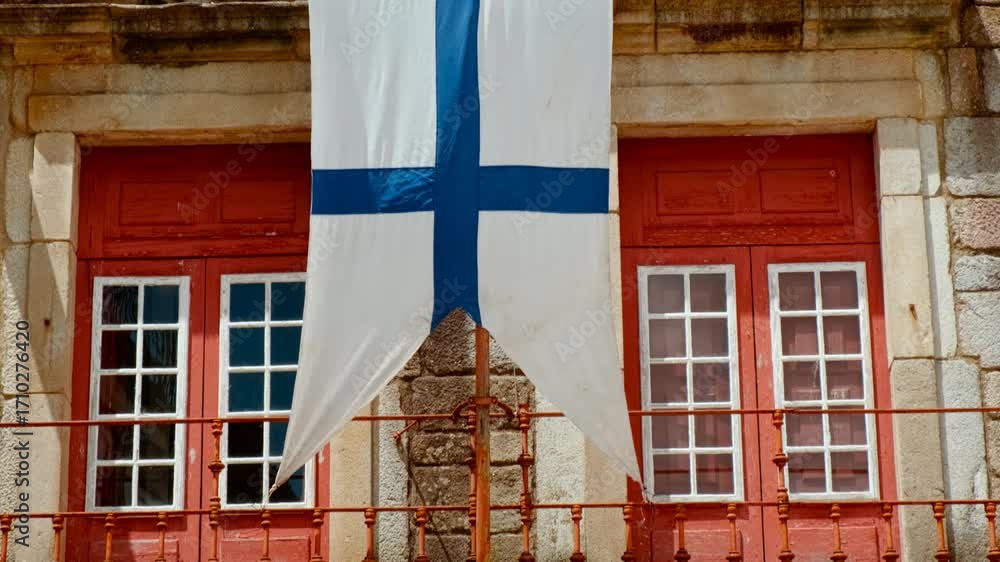 Largo da Oliveira Square in Guimaraes, Portugal features medieval arcades the Padrao do Salado monument and timber framed houses encircling lively cafe terraces