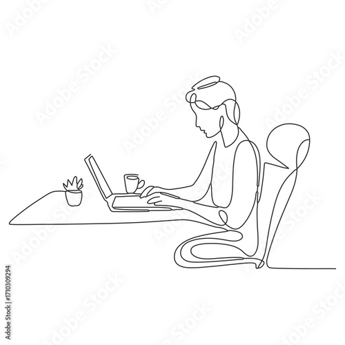 Person sitting at a desk working on a laptop with a coffee cup