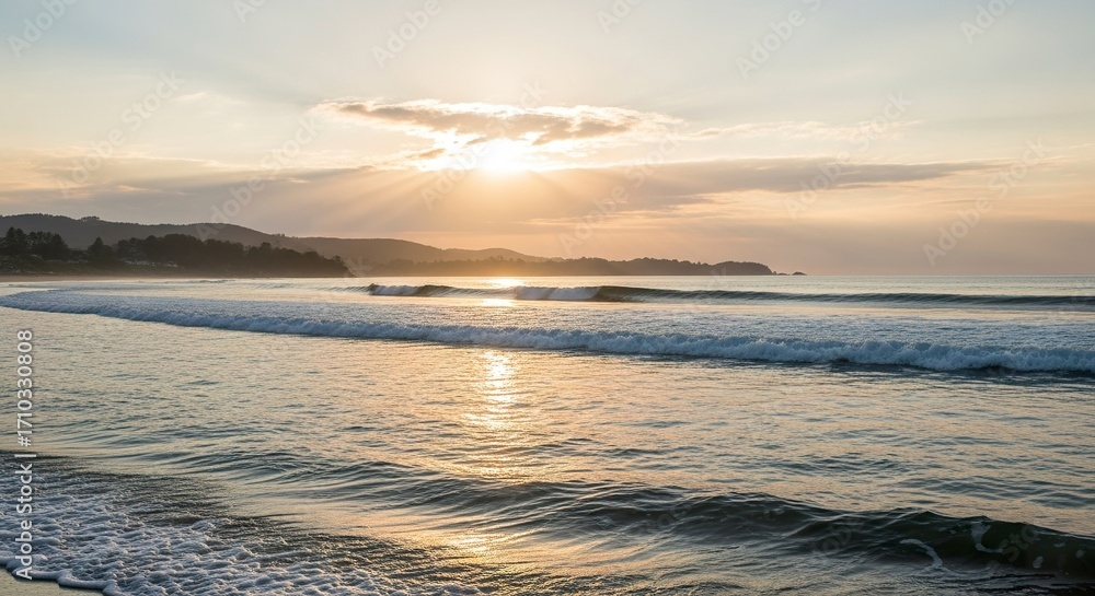 Obraz premium Sunset over ocean waves