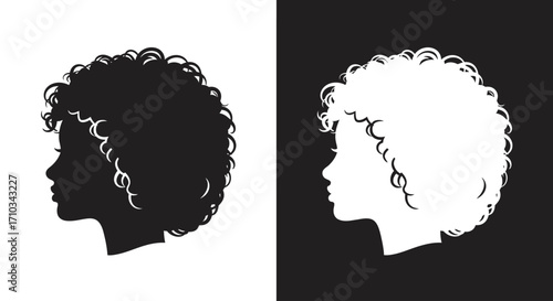 Black and white profile silhouettes of a woman with a beautiful, natural curly afro hairstyle.