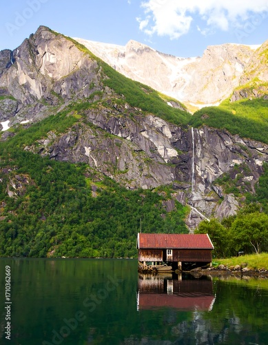 Mountain lake cabin reflection