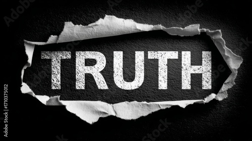 Ripped paper reveals the word truth on dark background