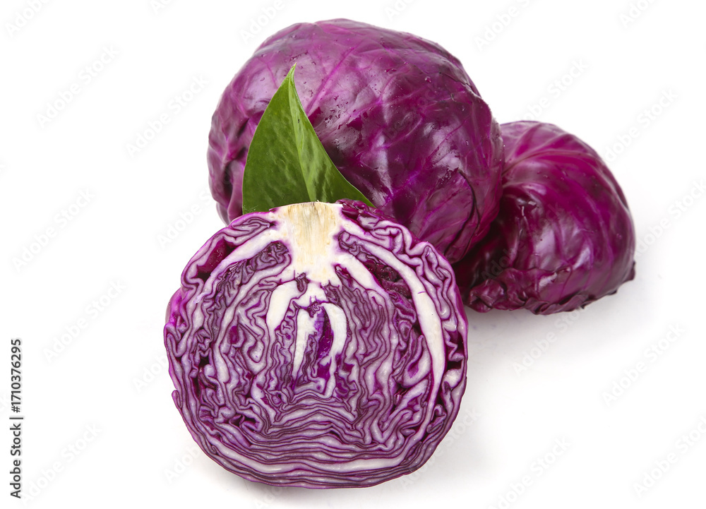 Fototapeta premium Purple cabbage heads with green leaves on white background, one sliced showing inner pattern