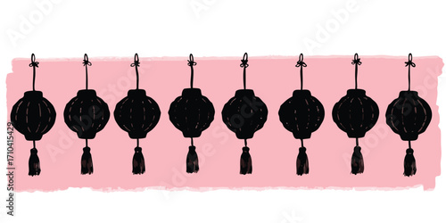 Row of black lanterns with tassels on a pink background