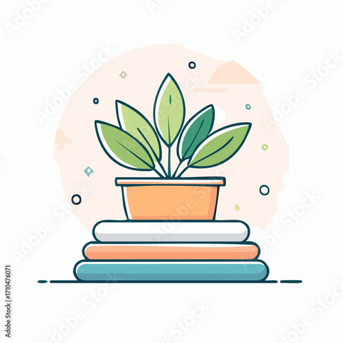 Green Plant in Orange Pot on Stacked Colorful Books