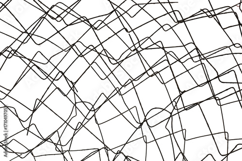 The texture of the metal mesh on a white background. Torn steel, metal mesh with holes