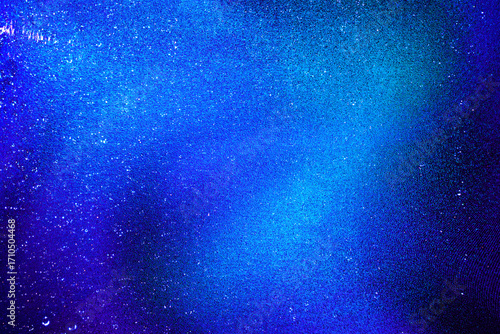 Black dark indigo blue gold orange glitter shiny abstract background for design. Twinkling glow stars effect. Fantastic, fantasy. Like outer space, night sky, universe. Grain, rough surface.