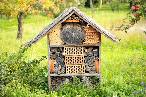 Large, self-built insect hotel on an orchard meadow in southern Germany