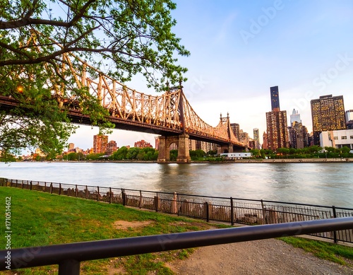 City skyline reflected in a river at sunset