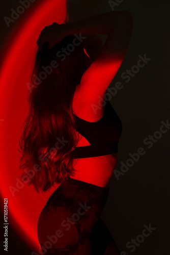 Dreamy Portrait, silhouette and double exposure, of a brunette in Orange-Pink-Red Glow	