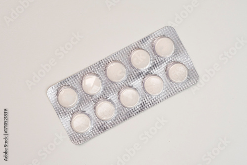 Pills, tablets in a blister pack isolated on white background, healthcare and medicine concept with copy space.