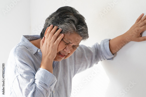 Aged woman feel dizzy and headache at home.
