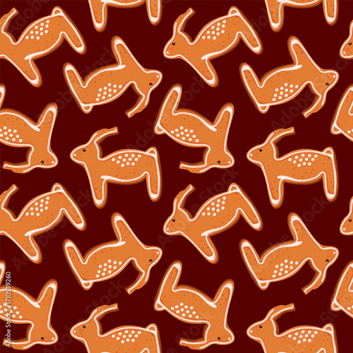 Gingerbread cookies in shape of reindeer seamless pattern in cartoon. Winter hand drawn baked goods.