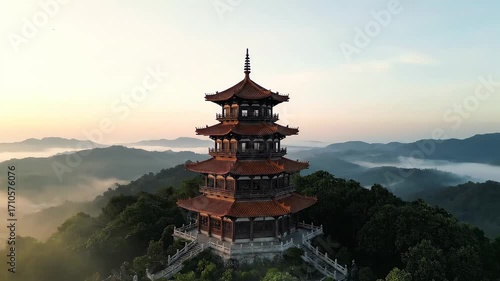 Wallpaper Mural Ancient Pagoda Tower Amidst Misty Mountains at Sunrise. Torontodigital.ca