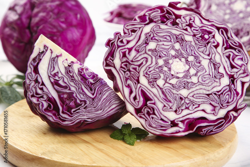 Purple Cabbage Cross Section with Beautiful Leaf Patterns on Wooden Board