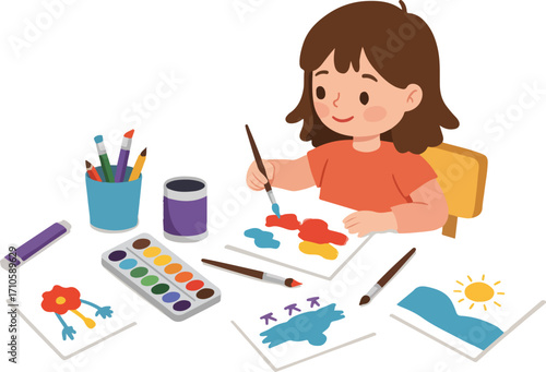 A young girl sits at a table, happily painting with watercolors and brushes.